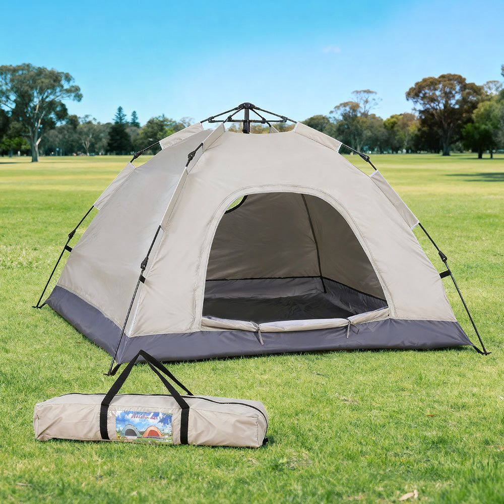Beige pop up tents, supplied with a carry bag.