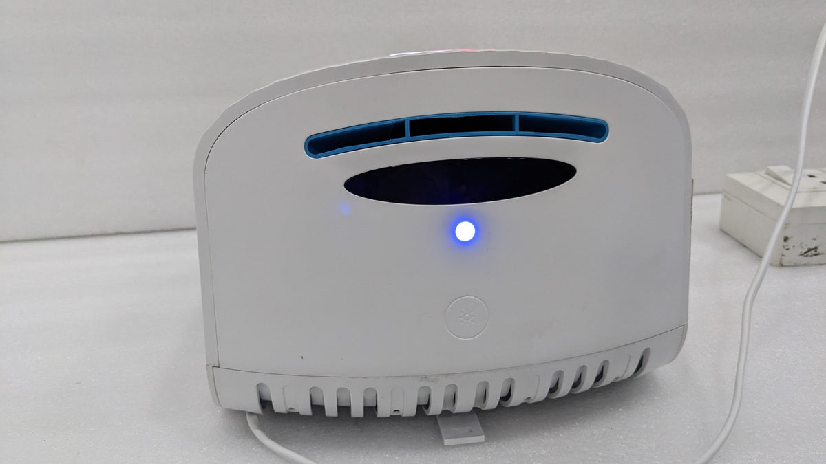 Underside of the Dolphy dome hand dryer showing the air outlet and sensor light