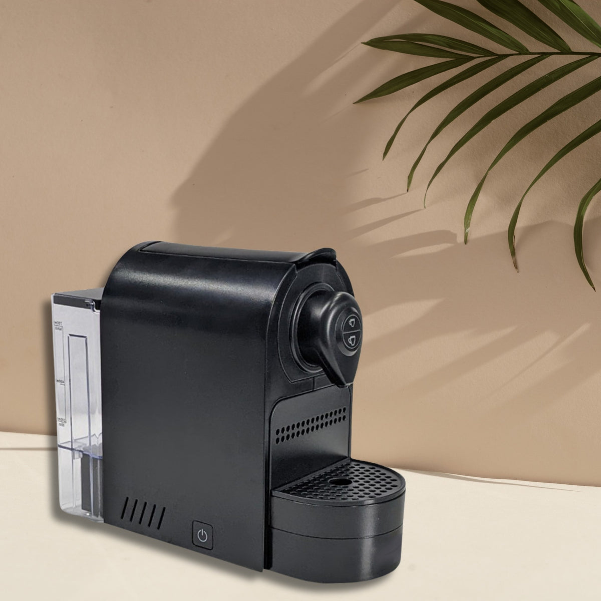 Dolphy black capsule coffee machine, side view showing the clear water tank