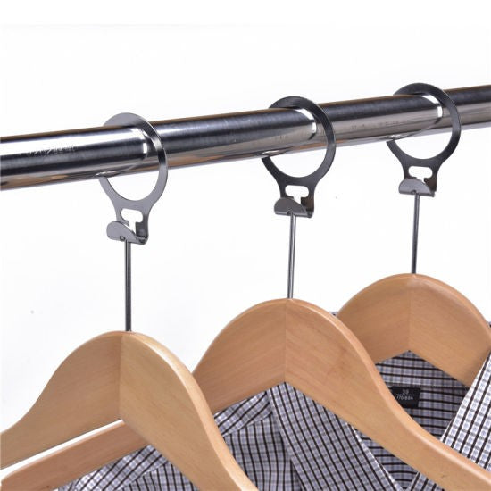 Close-up of Dolphy anti-theft hanger rings on a wardrobe rail with shirts on the hangers