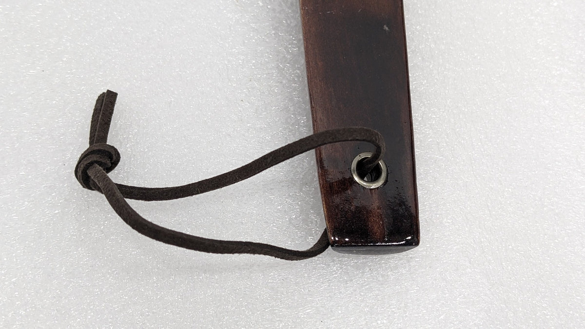 Close-up of the leather hanging loop through the metal eyelet on the Dolphy shoe horn