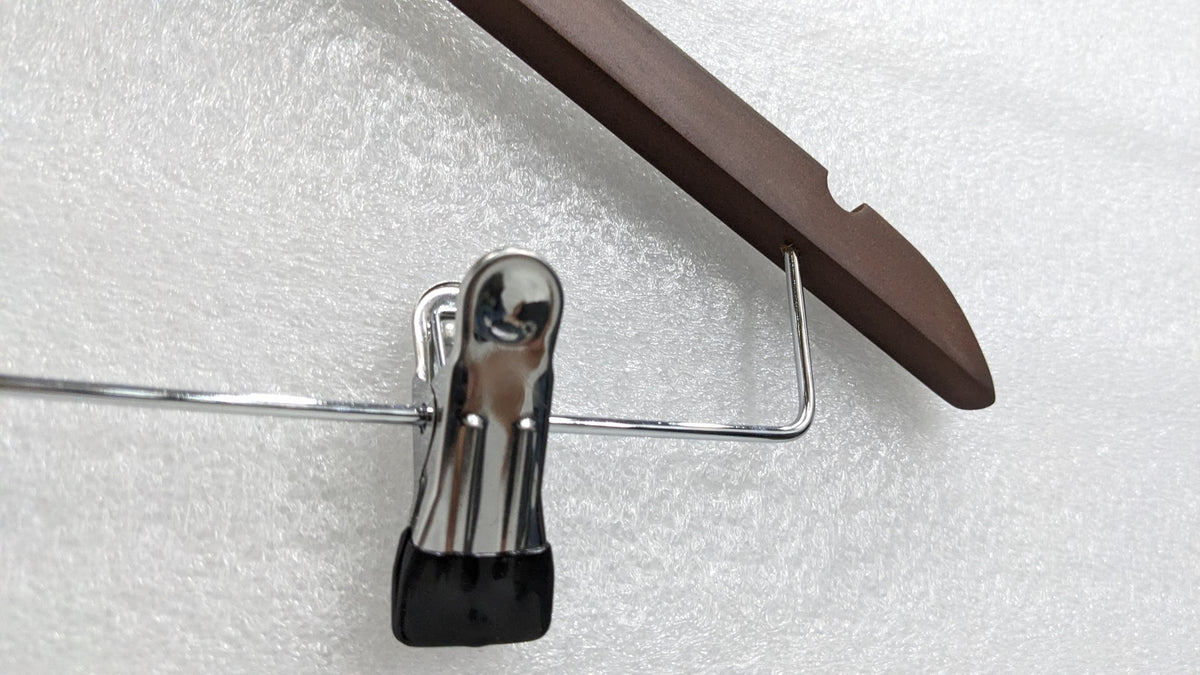 Close-up of the chrome clip with rubber grip on the Dolphy wooden hanger