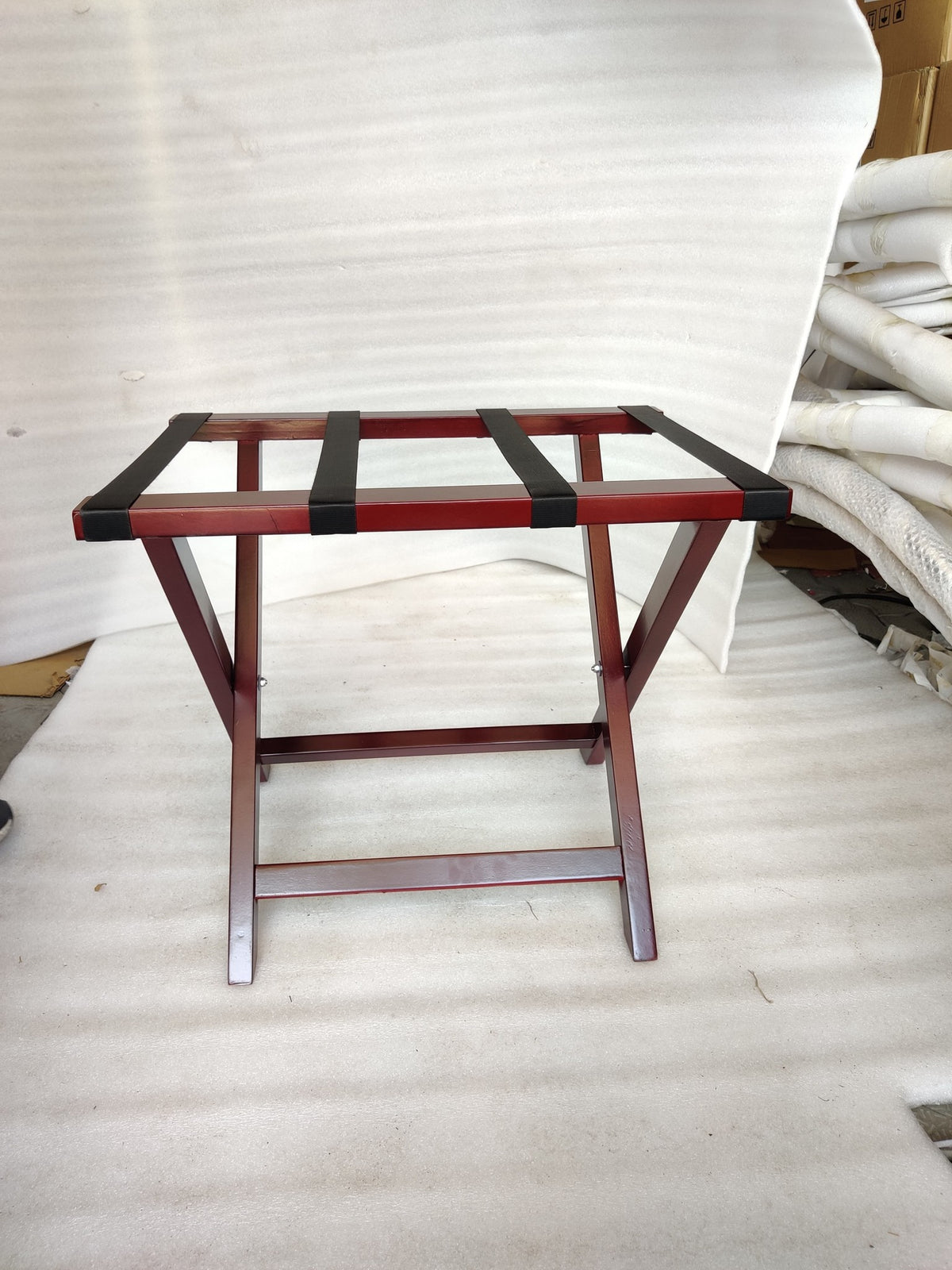 Dolphy cherry red luggage rack front view showing the four black webbing straps