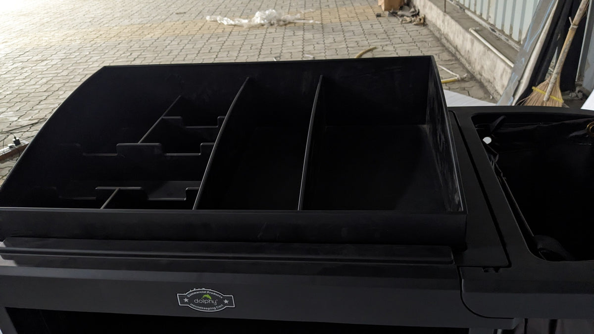 Top caddy compartments of the Dolphy black housekeeping cart