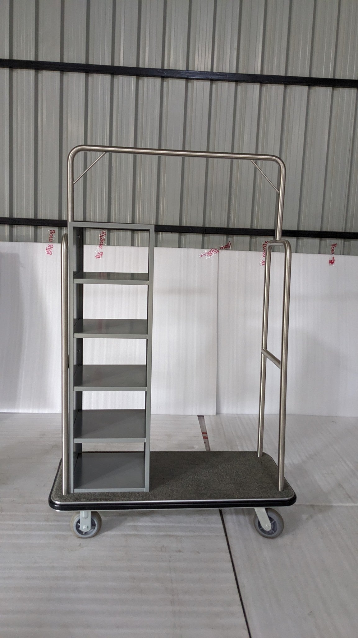 Dolphy stainless steel laundry and clothes delivery trolley with side shelving, front view