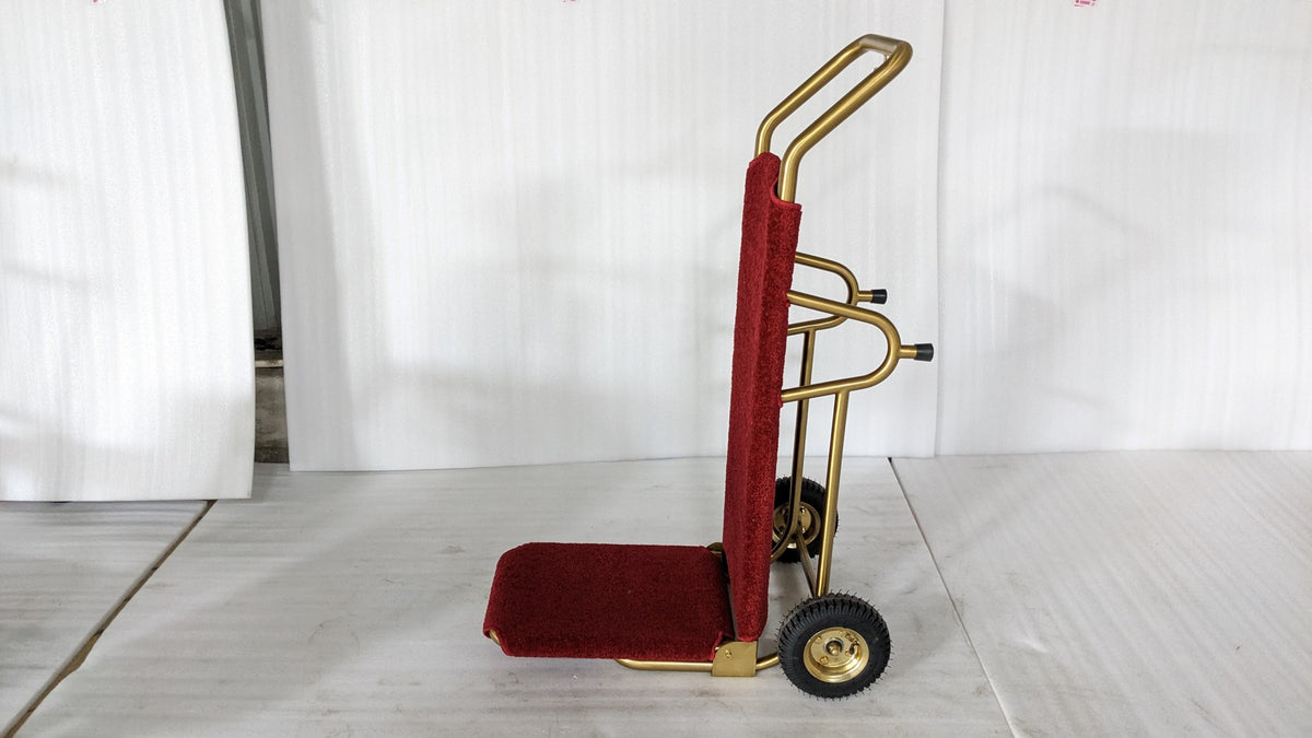 Dolphy gold and red foldable luggage trolley standing upright, side view