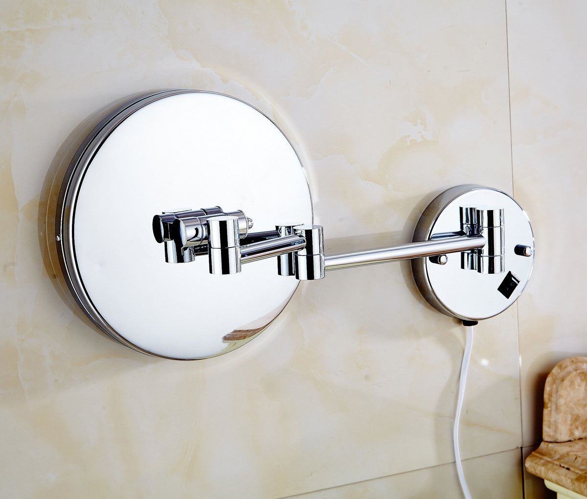 Back of the Dolphy LED wall mirror on its folding chrome arm and wall plate