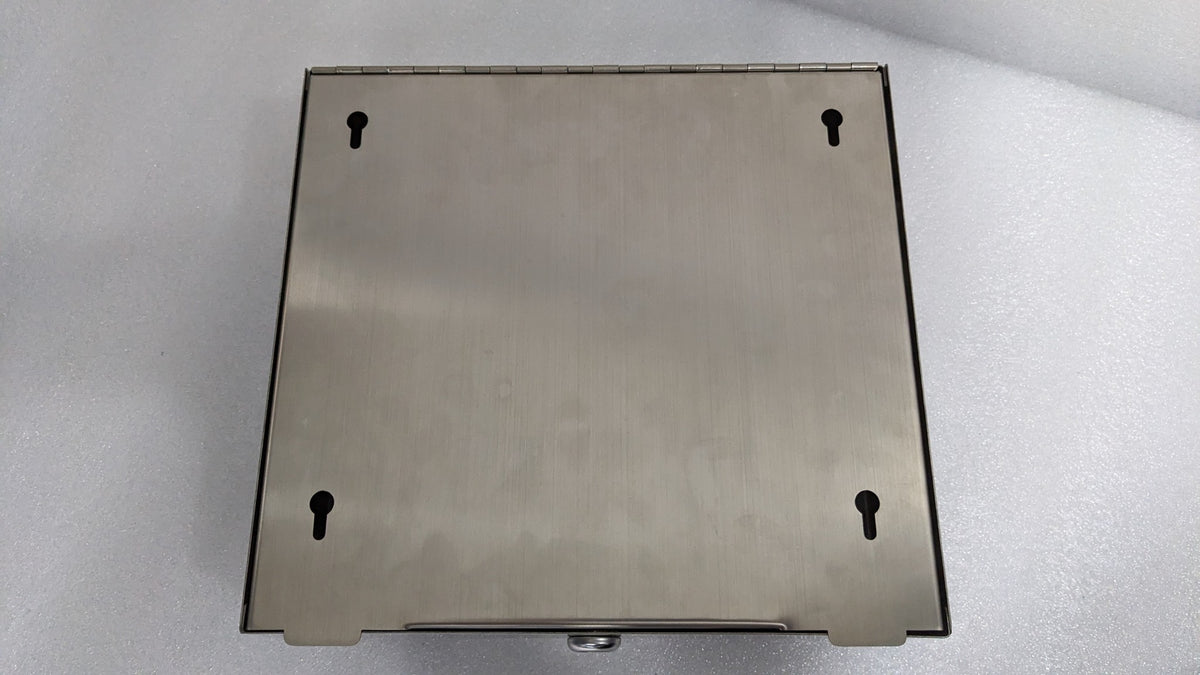 Back of the Dolphy stainless steel towel dispenser showing the keyhole wall-mount slots