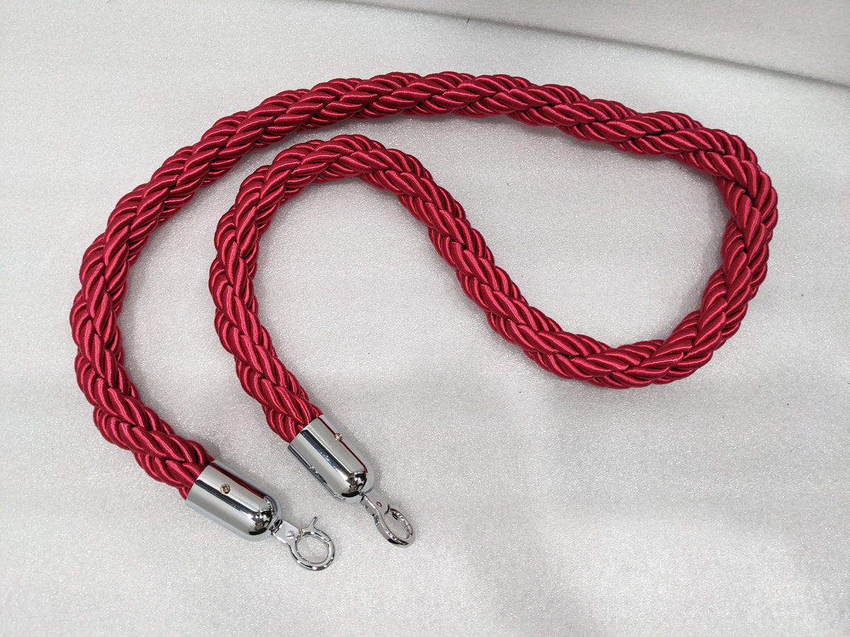 Red twisted nylon queue barrier rope with chrome snap-hook ends, real photo