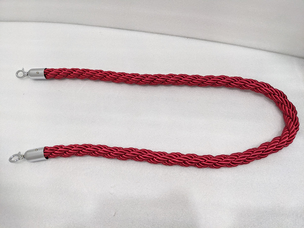 Red twisted queue barrier rope laid out full length