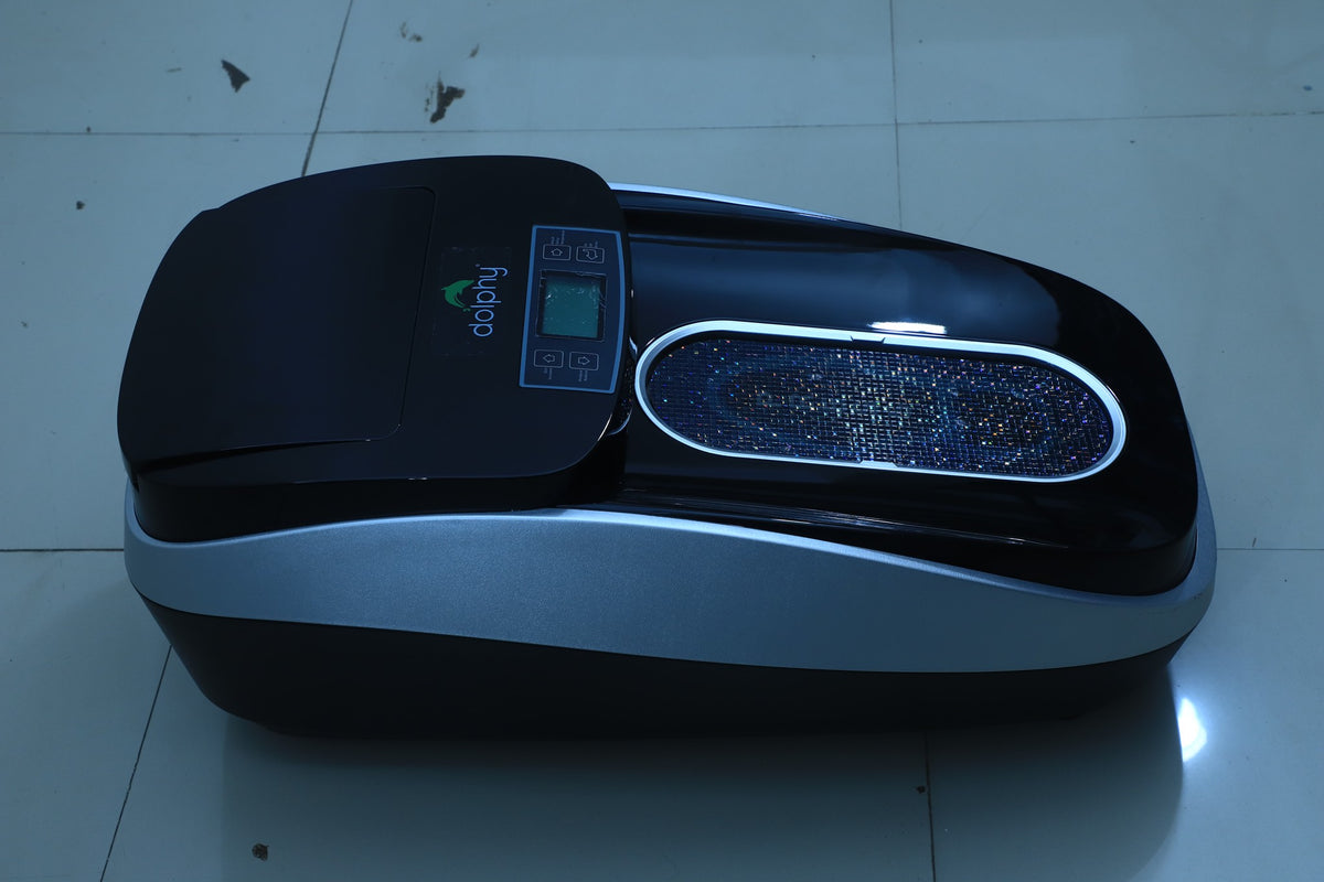 Dolphy automatic shoe cover dispenser, angled view of the foot plate and display