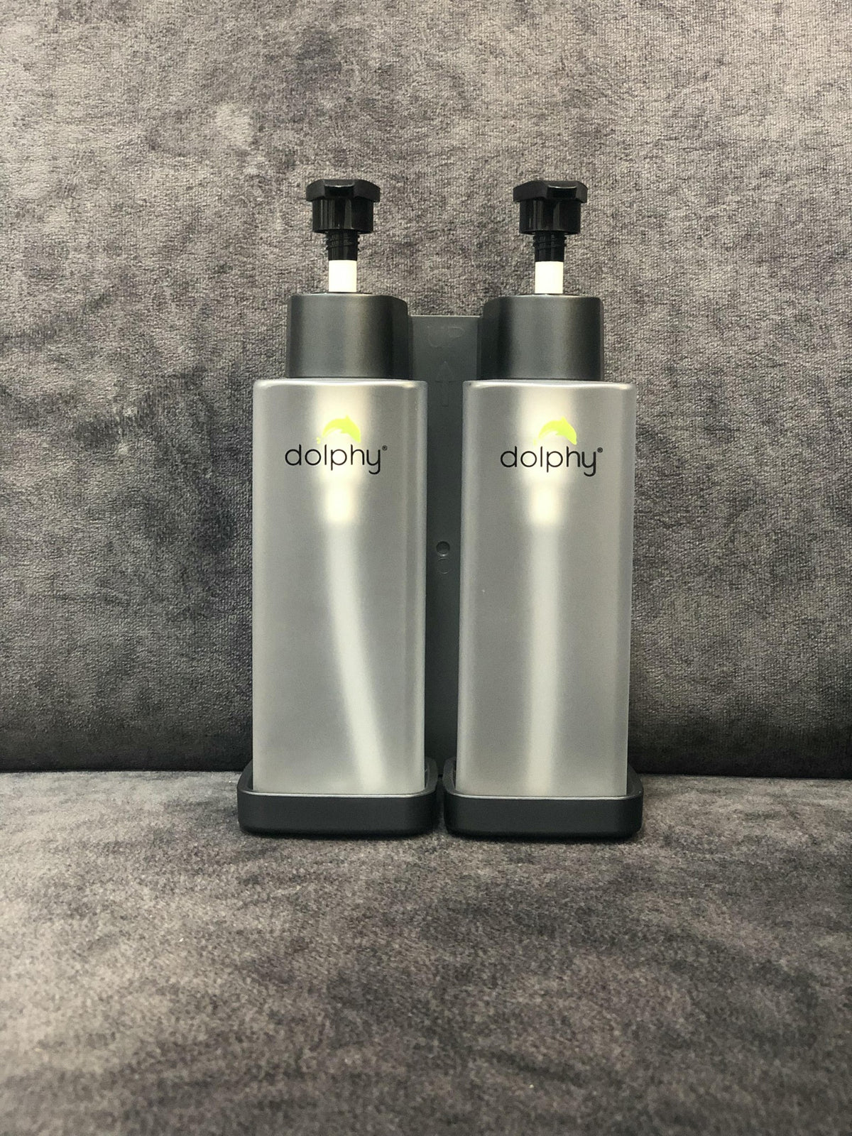 Two Dolphy clear 300ml pump soap dispensers in their black wall bracket