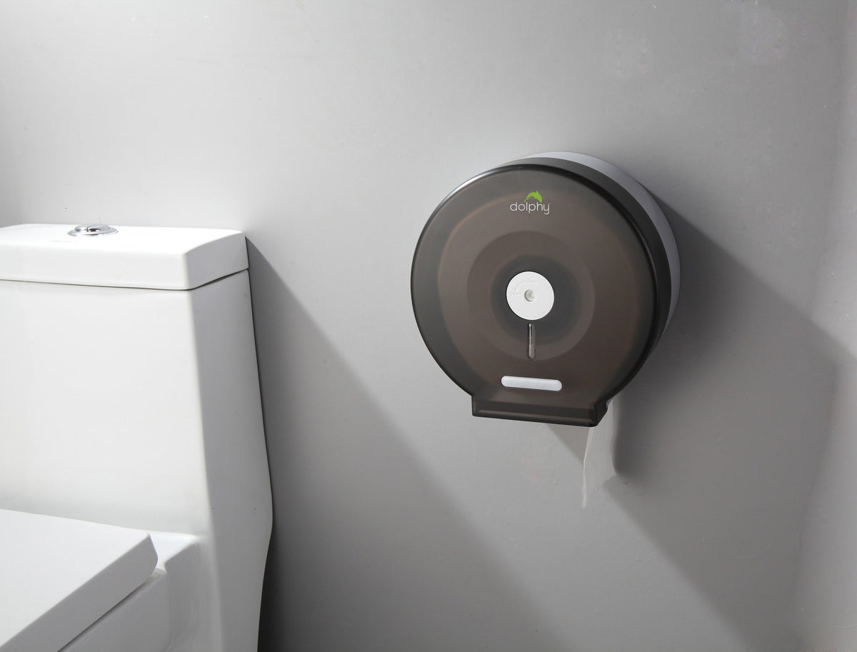 Dolphy jumbo toilet roll dispenser mounted on a washroom wall beside a toilet