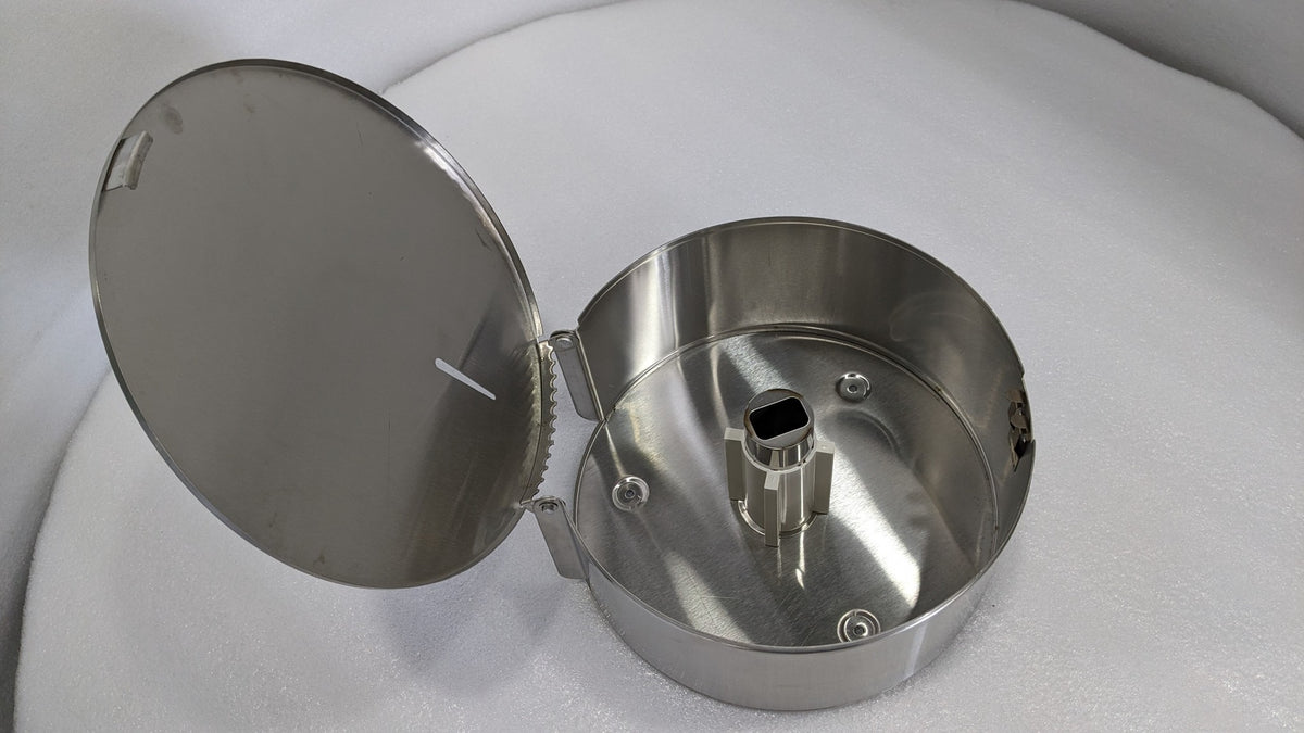 Dolphy stainless steel jumbo roll dispenser with the cover open, showing the roll spindle