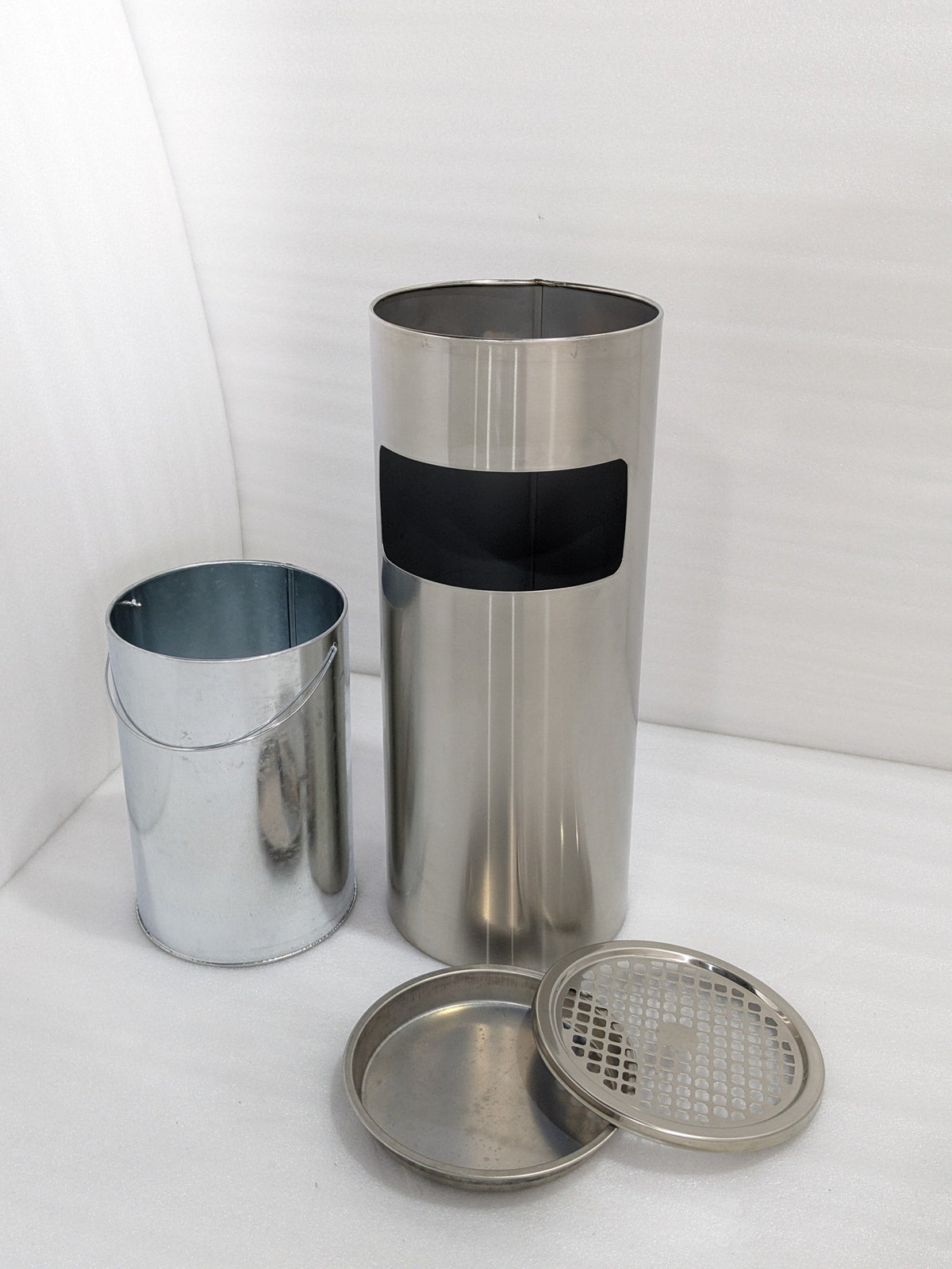 Dolphy ashtray bin parts laid out: steel body, inner bucket, ash tray and grille