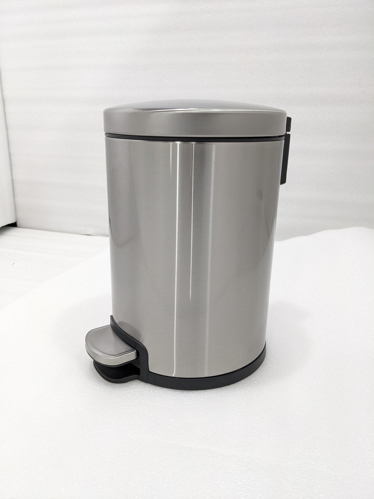 Dolphy 6L round stainless steel pedal bin, front view with foot pedal
