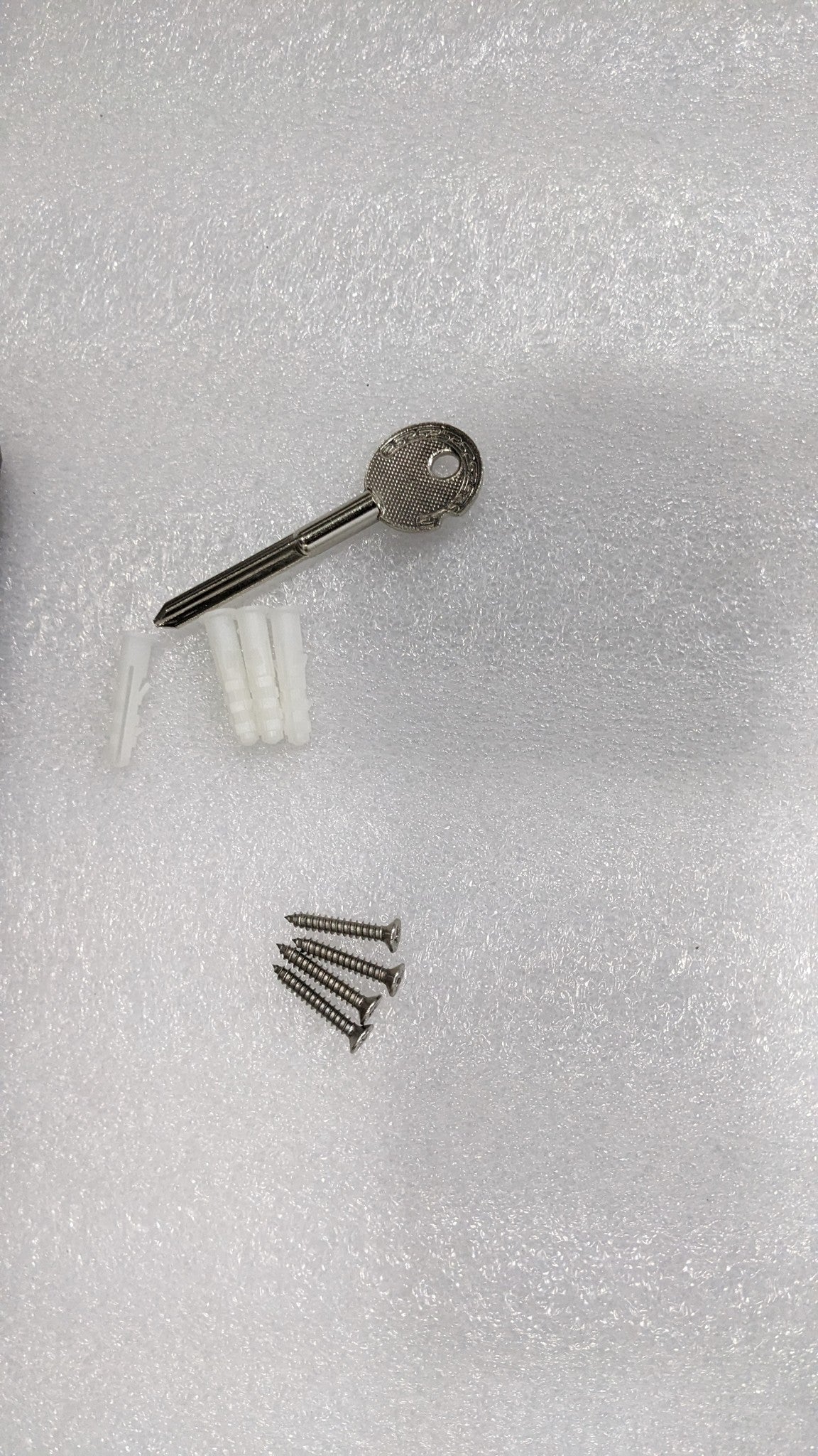 Key, screws and wall plugs supplied with the Dolphy recessed washroom panel