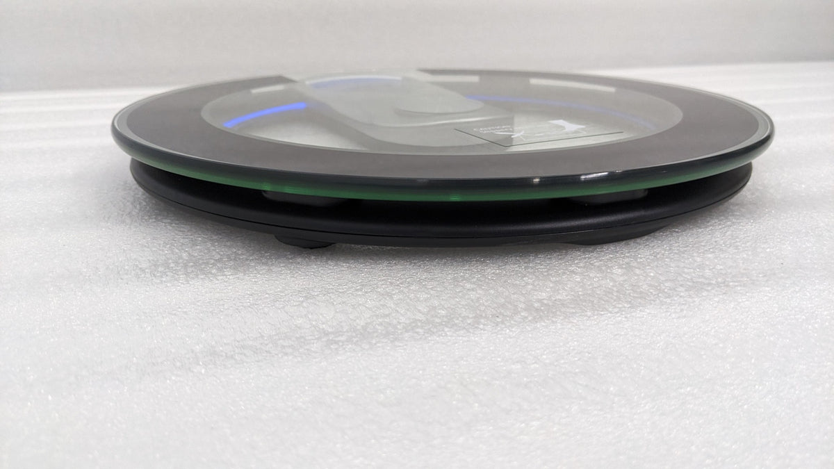 Dolphy round glass scale side view showing the slim profile