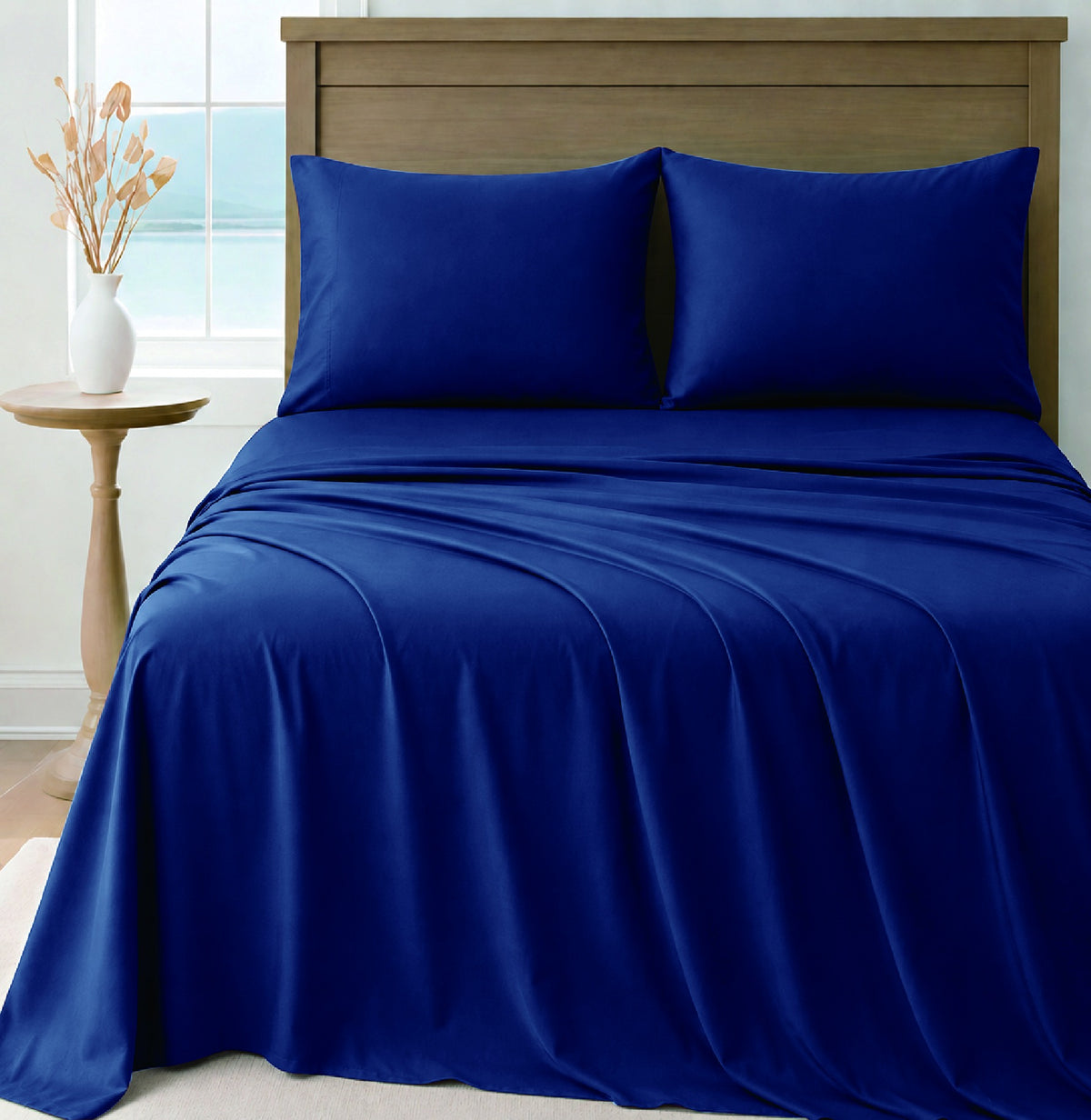 LinenCart navy brushed microfibre sheet set on a made bed