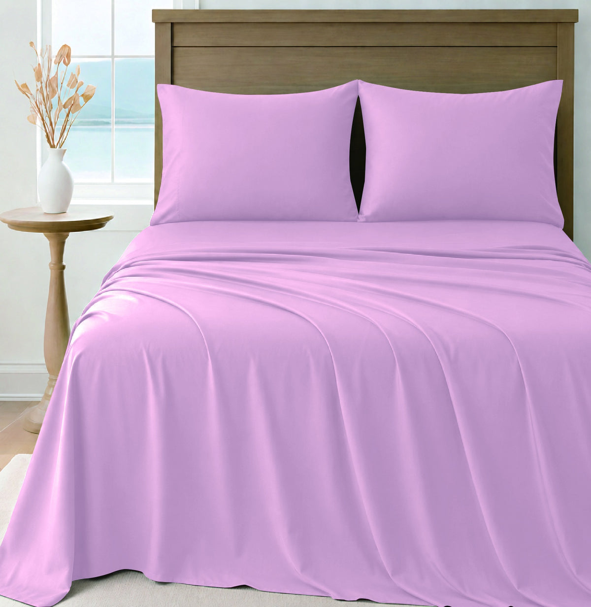 LinenCart pink brushed microfibre sheet set on a made bed