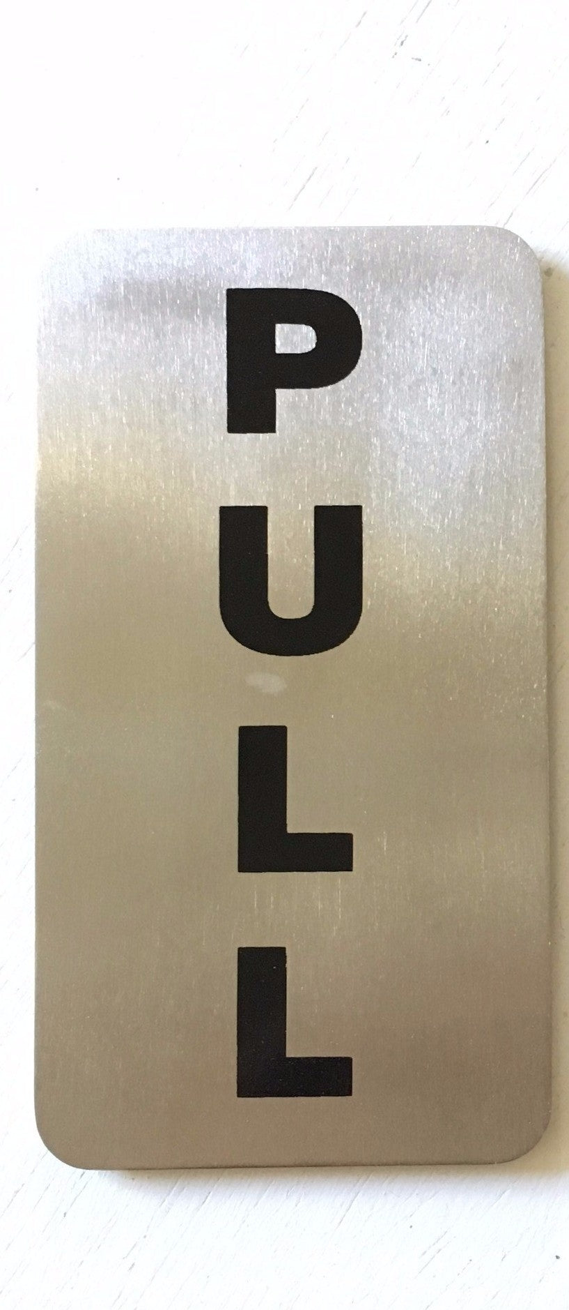Stainless steel PULL door sign with vertical black lettering