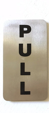 Stainless steel PULL door sign with vertical black lettering
