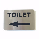 Stainless steel TOILET sign with an arrow pointing left