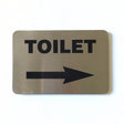 Stainless steel TOILET sign with an arrow pointing right