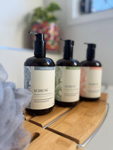 Kurrung Kakadu Plum pumps in a bathroom