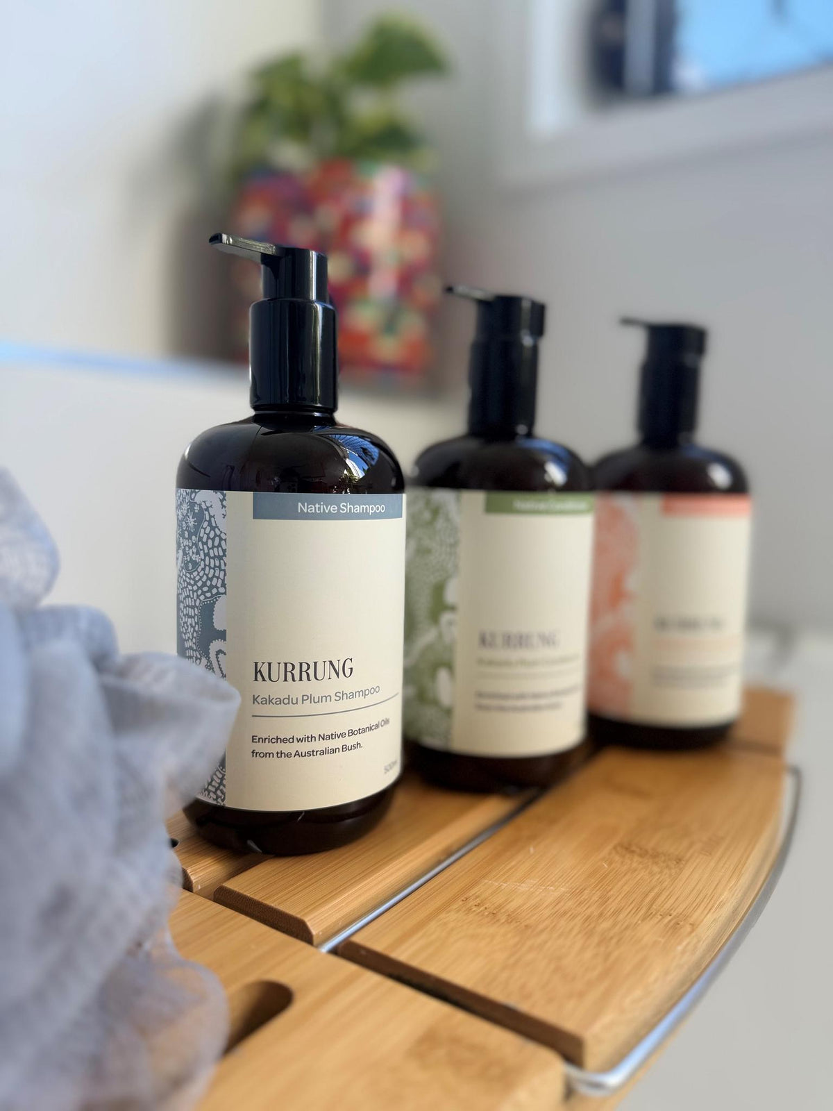 Kurrung Kakadu Plum pumps in a bathroom