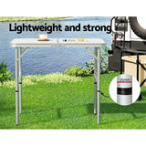 Folding camping table, with a carry handle.