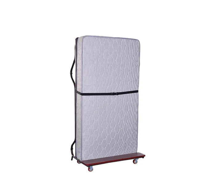 A foldable spring mattress bed with wheels, featuring a wooden headboard and a textured gray mattress cover. The bed is upright and appears to be in a storage position, with the wheels visible at the base.
