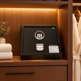 Dolphy top-opening digital safe, black, on a hotel wardrobe shelf
