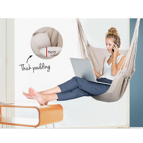 Cream hanging hammocks cushion pillow.