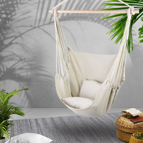 Cream hanging hammocks cushion pillow.