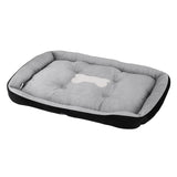 Cotton dog bed, machine washable, with a non-slip base.