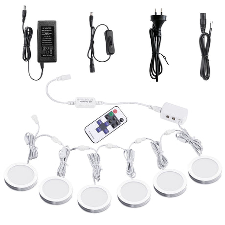 White dimmable puck lights, 12V, operated by remote control.