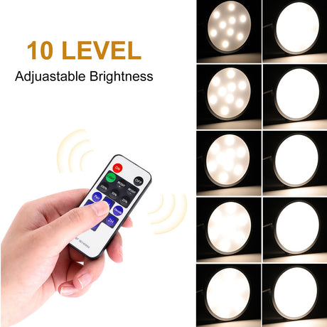 White dimmable puck lights, 12V, operated by remote control.