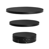 Black electric product display stand, operated by remote control.