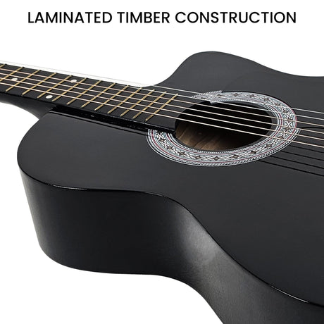 Black cutaway acoustic guitar.