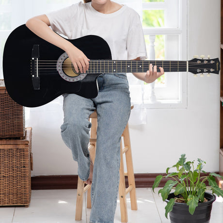 Black cutaway acoustic guitar.