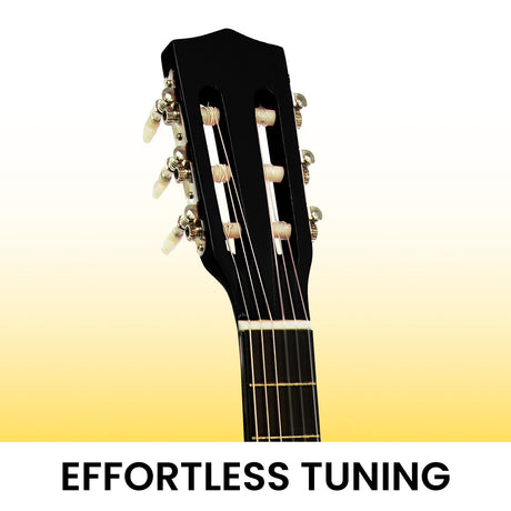 Black wooden guitar, supplied with a carry bag.