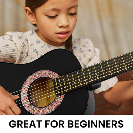 Black wooden guitar, supplied with a carry bag.