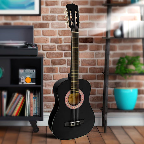 Black wooden guitar, supplied with a carry bag.