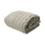 Taupe knitted throw rug.