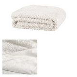 Ivory fur throw rug.