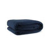 Navy cotton waffle blanket, single size.
