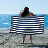 Blue cotton beach towel, machine washable.