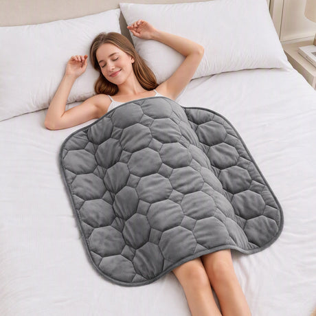 Grey velvet quilted weighted lap blanket.