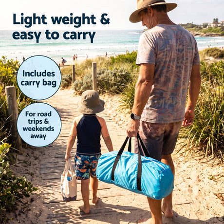 Blue portable beach tent, supplied with a carry bag.